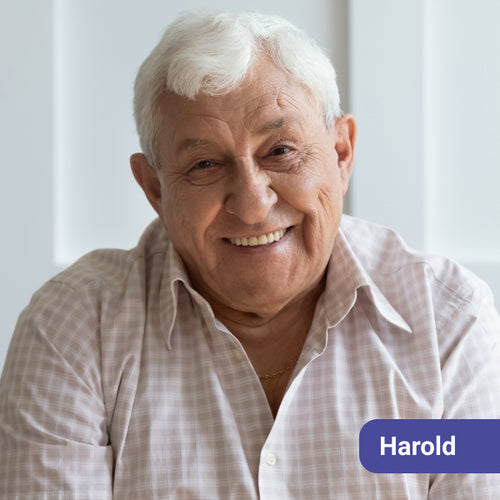 Man with white hair wearing a light-colored shirt, with a name tag labeled 'Harold' on a light background.