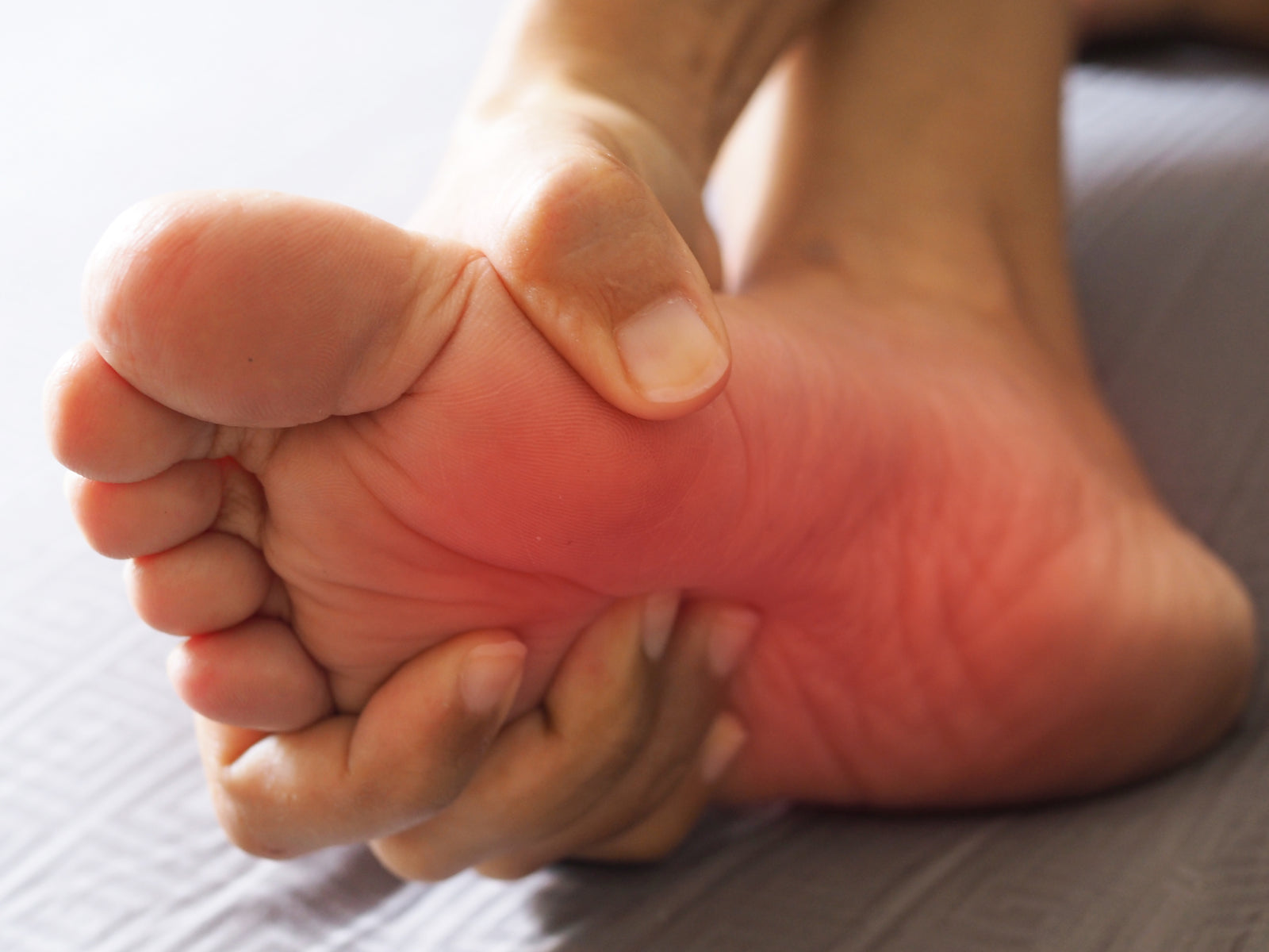 Close-up of a foot with a red spot, indicating peripheral neuropathy pain